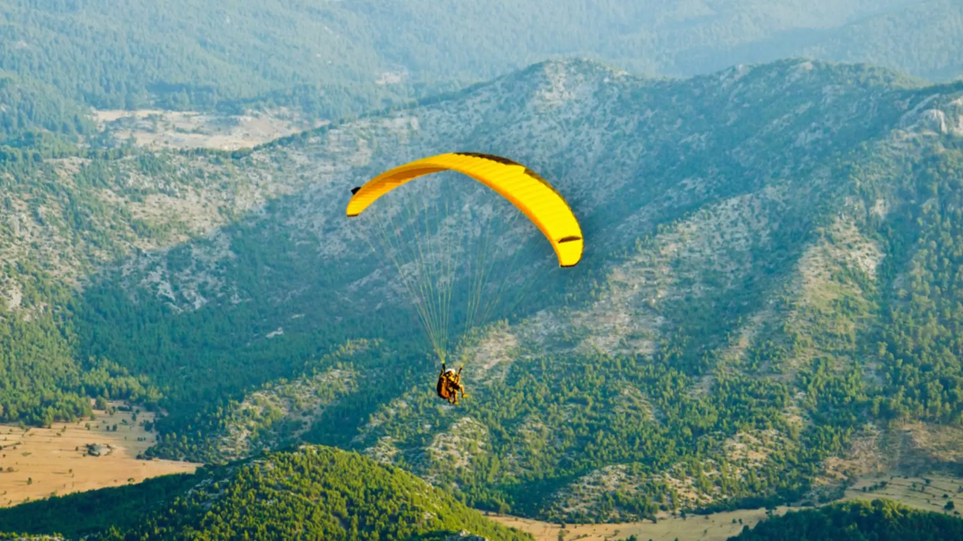 Paragliding, a buggy and camel ride adventure, and dinner with a show in Agafay