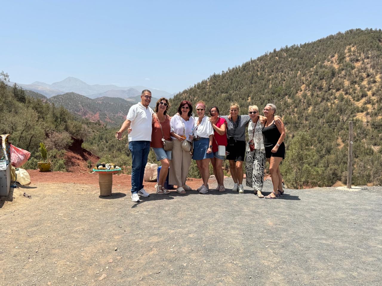Guests with their host at an Atlas Mountains viewpoint